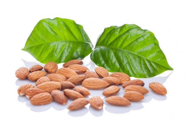 Almond nuts with leaves. Isolated on a white background.