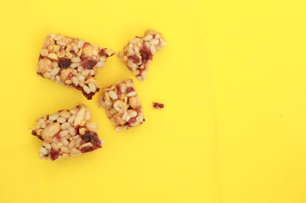 Almond and oat protein bars on yellow background