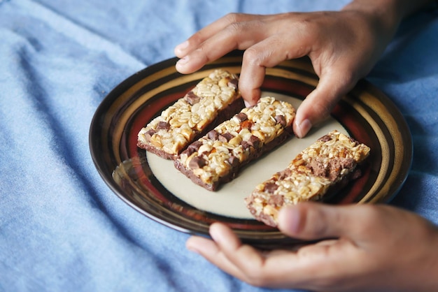 Almond raisin and oat protein bars on table