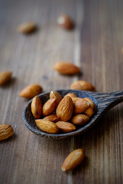 Almond seed on wood table background