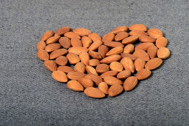 Almonds in a clay pot isolated on a white background