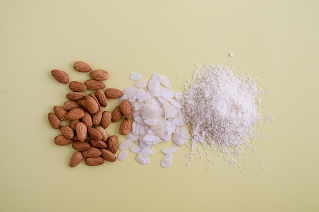 almonds flakes and flour made from it top view