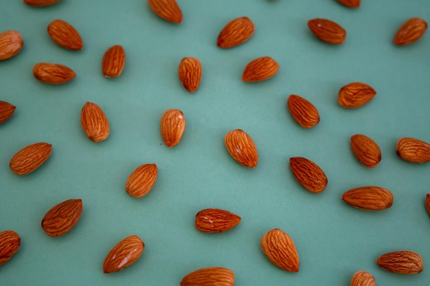 Almonds isolated. Walnuts on blue background. Brazilian nuts Almond. Arranged on blue background