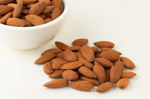 Almonds isolated on white background Healthy food