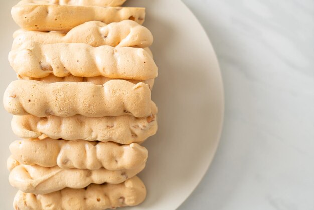 Almonds meringue stick on plate French snack dessert style