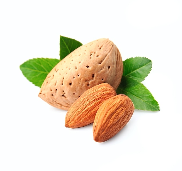 Almonds nuts with leaves isolated on white