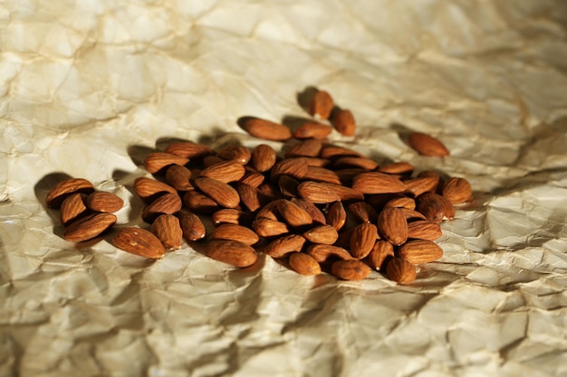 Almonds on old paper background