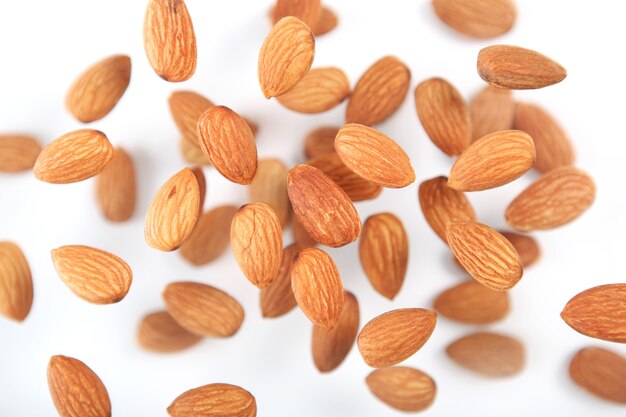 Almonds on the table closeup on a light background