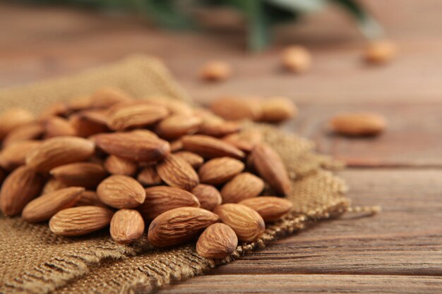 Almonds on the table closeup on a light background