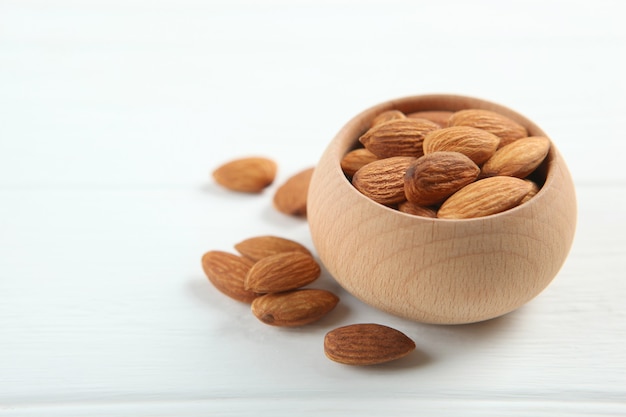 Almonds on the table closeup on a light background