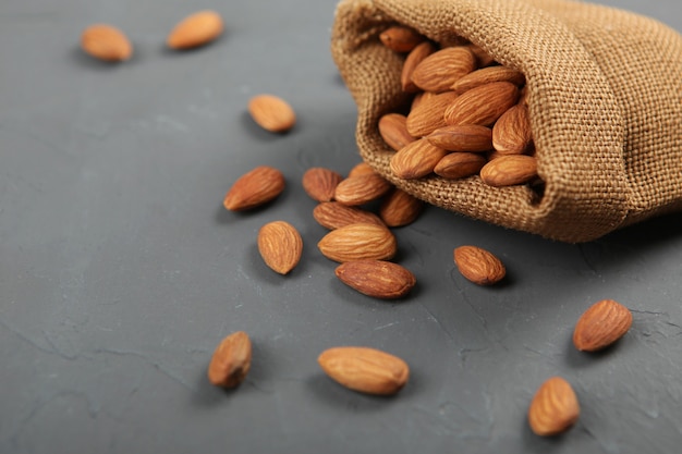 Almonds on the table closeup on a light background