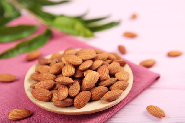 Almonds on the table closeup on a light background