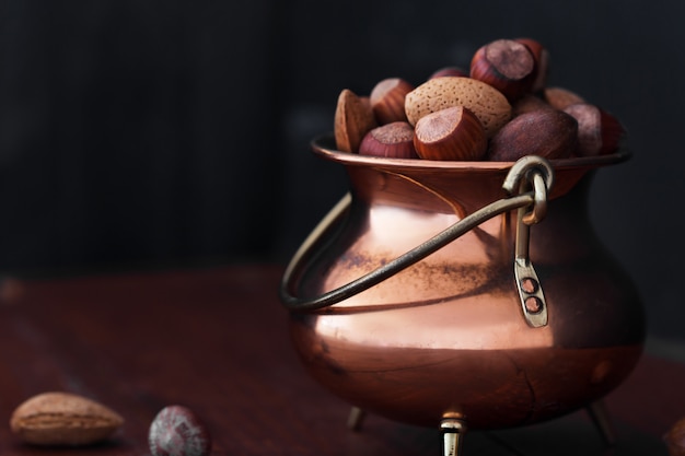 Almonds, walnuts and hazelnuts in metallic bowl