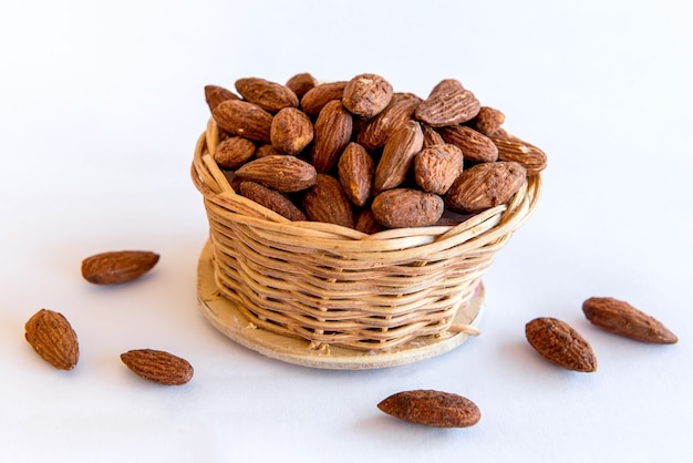 Almonds on white background. Healthy grains.