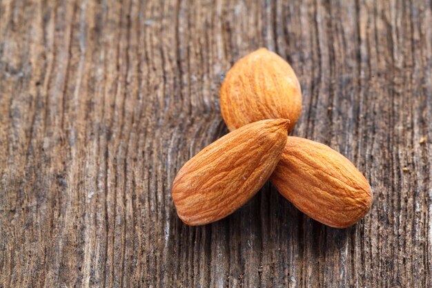 Almonds on wood background