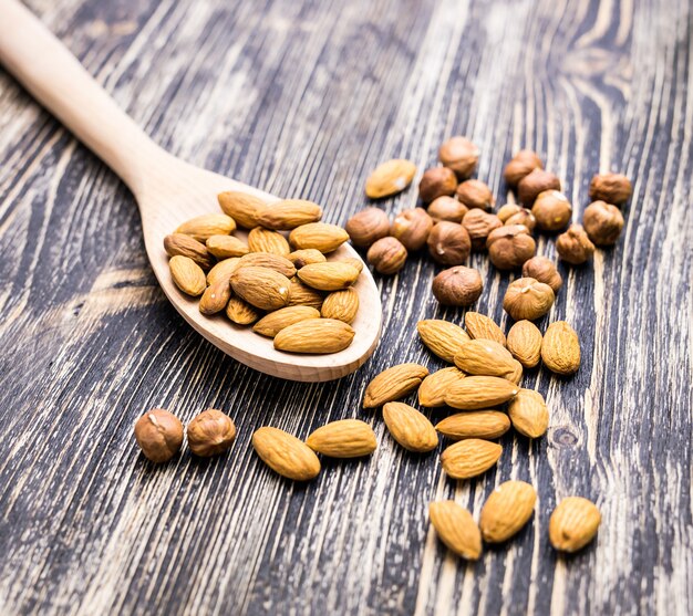 Almonds on wooden background