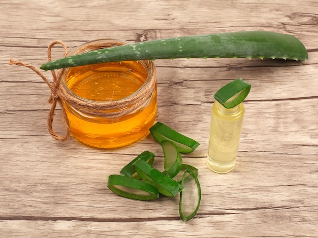 Aloe Vera and honey closeup on light wooden background Sliced Aloe vera