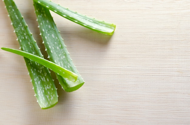 Aloe vera isolated on wooden board background 