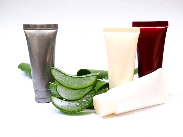 Aloe vera sliced and cream tube Skincare gel for beauty isolated on white background.