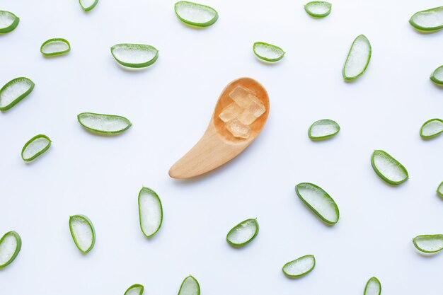 Aloe Vera  sliced  with Aloe Vera  gel on wooden spoon isolated on white background.