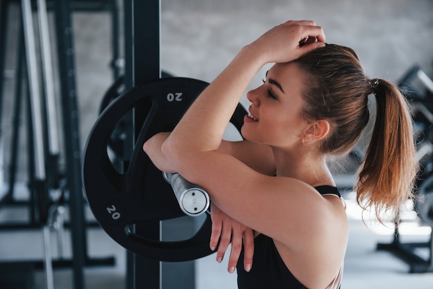 Alone in the room.  gorgeous blonde woman in the gym at her weekend time.