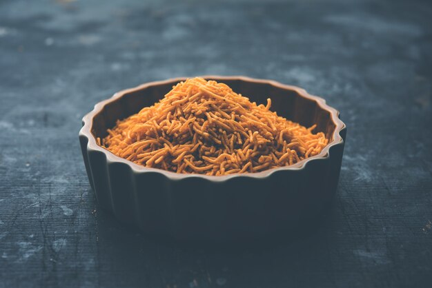 Aloo Bhujiya or Potato Bhujia also known as Namkeen sev. Popular Bikaneri recipe served in a bowl or plate. selective focus