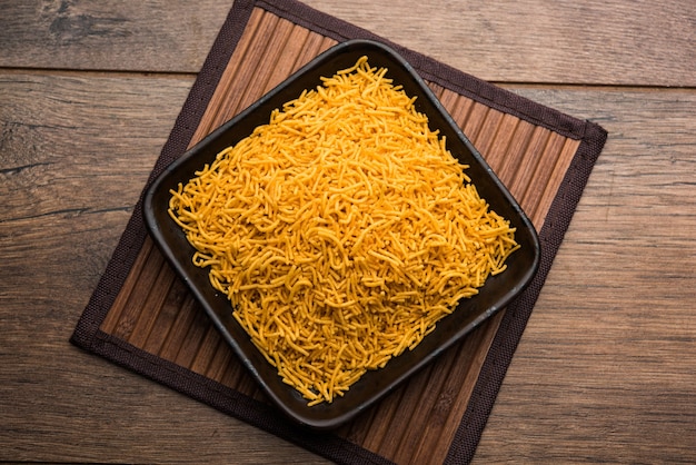 Aloo Bhujiya or Potato Bhujia also known as Namkeen sev. Popular Bikaneri recipe served in a bowl or plate. selective focus