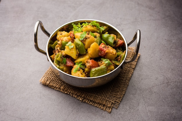 Aloo capsicum sabzi or potato and bell pepper sabji is an Indian vegetarian recipe for main course