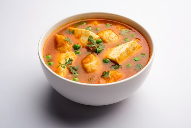 Aloo Matar Paneer Recipe from India made using Potato Green peas with cottage cheese cooked in spicy curry. selective focys