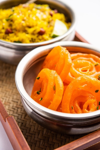 aloo poha with jalebi snack combination also called imarti and kande pohe