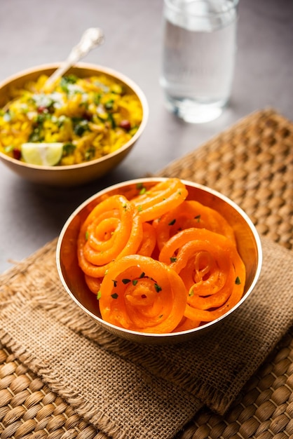 aloo poha with jalebi snack combination also called imarti and kande pohe
