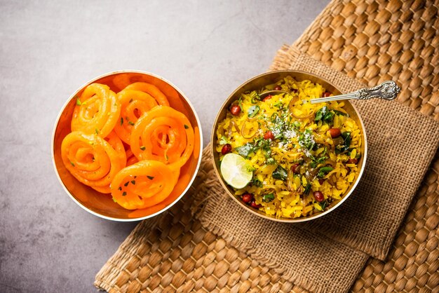 aloo poha with jalebi snack combination also called imarti and kande pohe