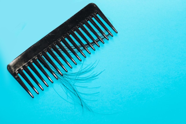 Alopecia hair loss concept fallen hair on combs from disease