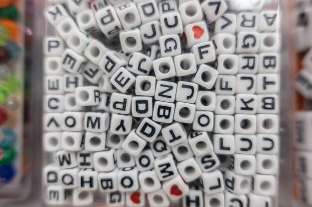 Photo alphabet beads used for arts and crafts in a bag