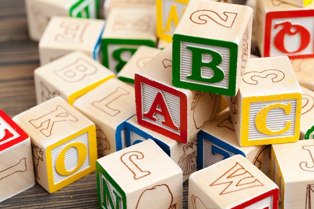 Alphabet blocks ABC on wooden table