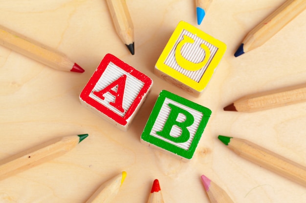 Alphabet blocks ABC on wooden table
