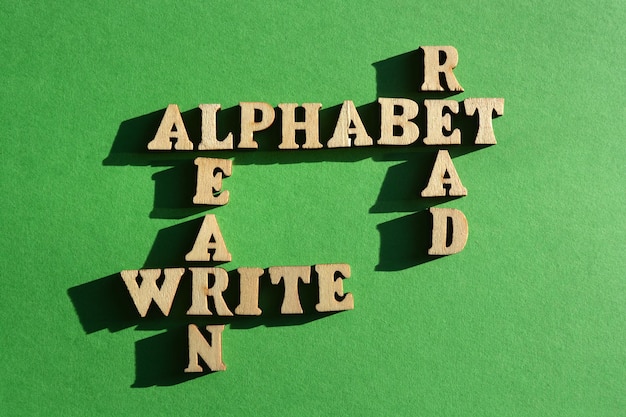 Alphabet Read Write Learn words in wooden alphabet letters in crossword form isolated on green background