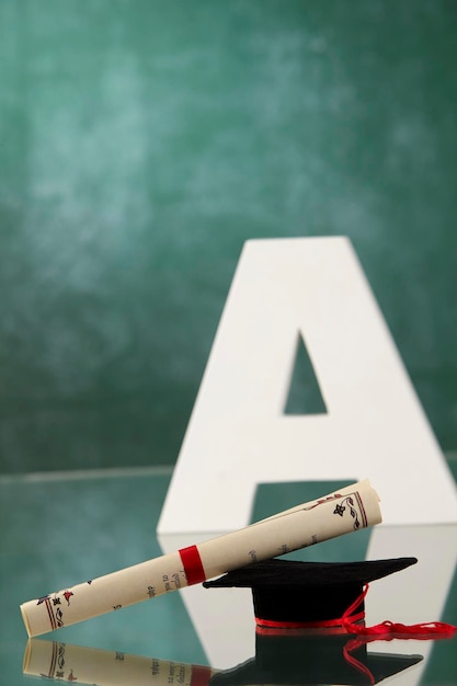 Photo alphabet a with mortar board in front