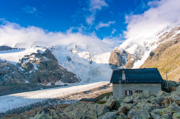 Alpine hut above the glacier