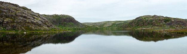 Alpine lake on the coast of the Barents sea. Kola Peninsula, Russia.