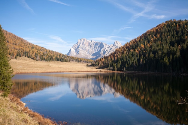 Alpine lake with dolomites in background Calaita lake in autumn season