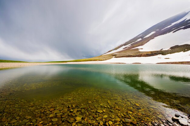 Alpine mountain lake landscape, colorful nature view, Georgian lake, travel destination, hiking place.