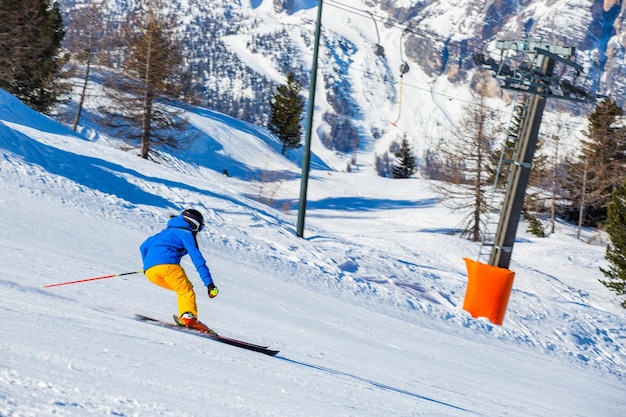 Alpine skier on slope at Cortina