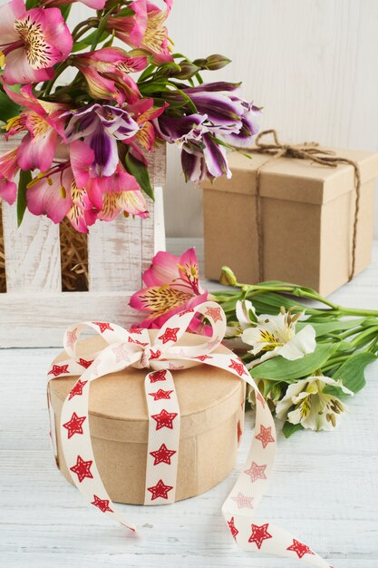 Photo alstromeria flowers in the wooden box, gift