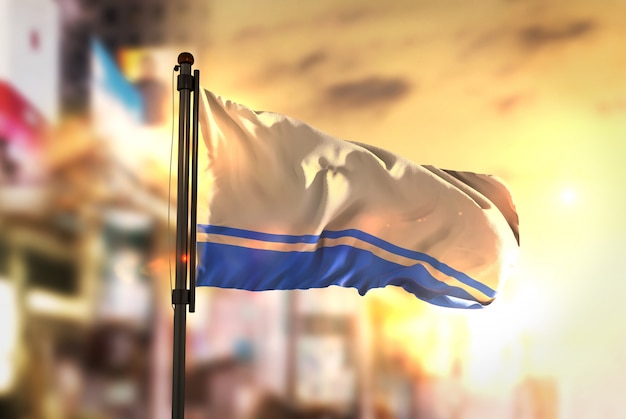 Altai Republic Flag Against City Blurred Background At Sunrise Backlight