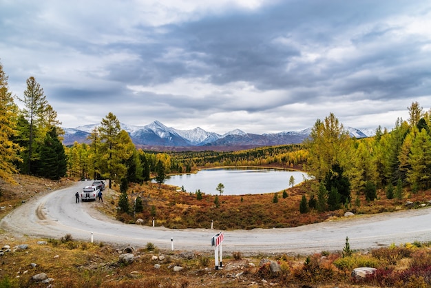 Altai, Russia, Kidelyu Lake and snowcapped peaks of Kurai Range. Autumn mountain landscape