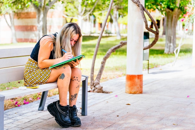 Alternative college girl studying on campus before the final exam