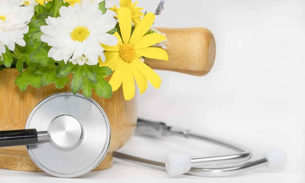 Photo alternative medicine concept stethoscope and mortar and pestle