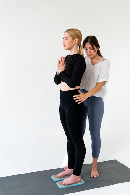 Alternative medicine and mindfulness practice standing on sadhu board nails barefoot