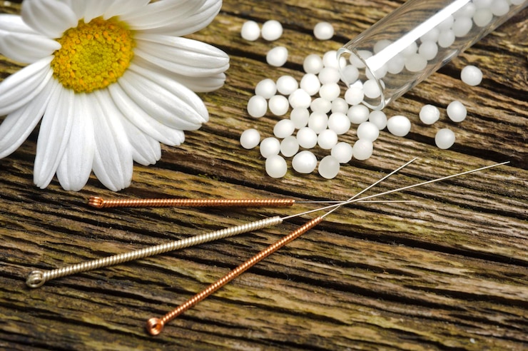 Photo alternative medicine with acupuncture and herbal pills